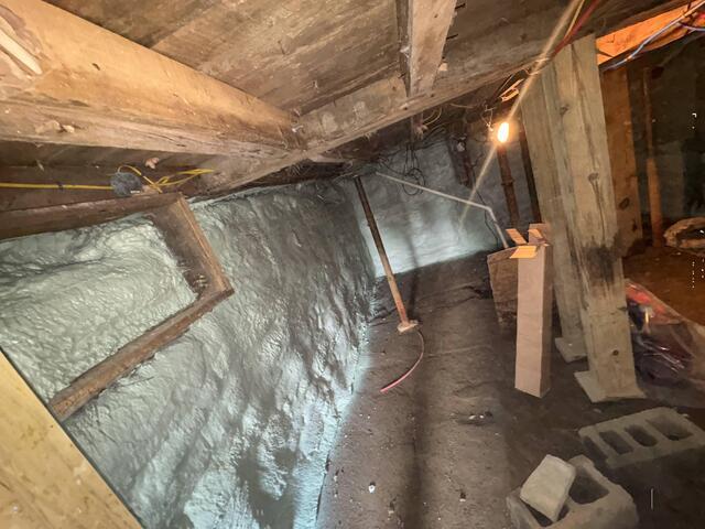 Spray Foam Insulation on Stack Stone Foundation