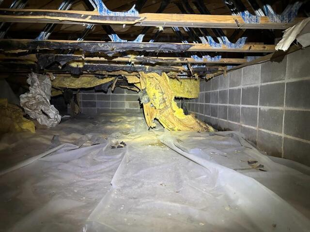 Falling insulation due to moisture weight, and signs of water seepage on the walls.