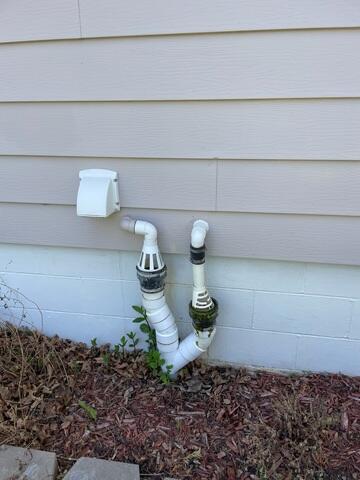 During: Then, Sam inspected the IceGuard on the outside of the home, ensuring it was working properly.