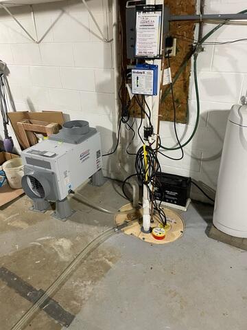 After: Sam secured an Aprilaire in the basement near the TripleSafe Sump Pump.