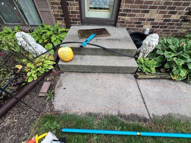 The concrete slabs in front of the step had begun settling