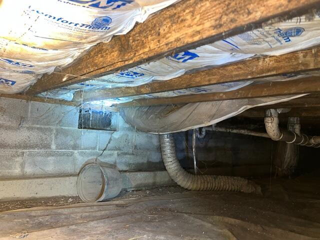 This photo shows what our inspector saw when looking at the floor joists in the crawl space. They were in the late stages of moisture damage, and were holding on for dear life.