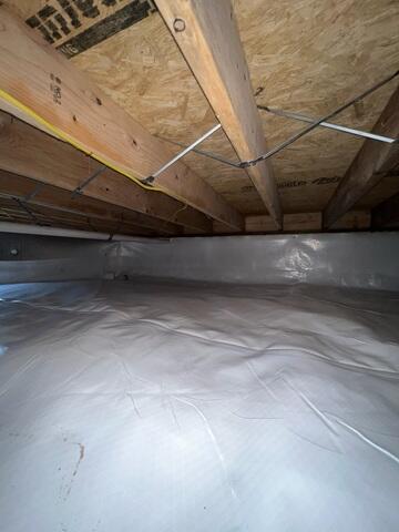 To permanently stop moisture from entering the space from the earth, our crew encapsulated the entire crawl space with our heavy-duty CleanSpace Vapor Barrier System. This durable, bright white liner completely isolates the home from the ground, blocking soil moisture and humidity from permeating the area.