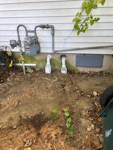 Lastly, we installed our IceGuard Discharge Line to prevent pump failure during freezing weather. If the exterior discharge pipe becomes blocked by ice or snow, the IceGuard's specially engineered ports allow the SmartSump to continue pumping water out and away from the foundation, providing crucial all-weather reliability.