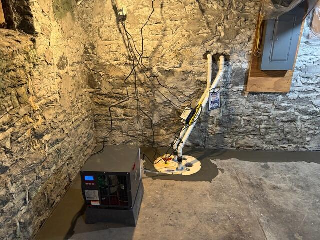 SaniDry Sedona dehumidifier and TripleSafe sump system installed to control humidity and discharge water safely. The TripleSafe comes with three pumps inside its liner, including one that is backed by a battery backup system in case of power failure. The SaniDry Sedona can remove up to 99 pints of water out of the air in a day, and helps filter dust mites, spores, and other fine particles. The TripleSafe lid is airtight and comes with an airtight floor drain and an alarm system.