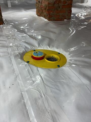 CleanSpace® Crawl Space Encapsulation System: A durable, 20-mil vapor barrier was laid across the crawl space floor and walls, sealing out ground moisture and creating a bright, clean surface. The CleanSpace system directs any water seepage toward the drainage system, preventing humidity and mold growth.

SmartDrain® Drainage System: Designed for encapsulated crawl spaces, the SmartDrain was installed beneath the CleanSpace liner to capture any unexpected plumbing leaks or seepage. The system features a WaterWatch® alarm that alerts the homeowner if water is detected.