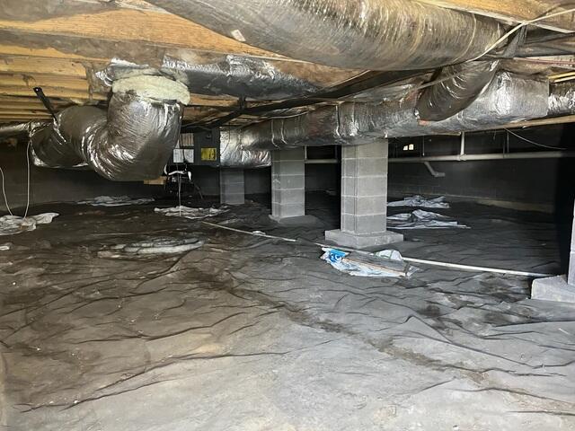 The duct and plumbing systems in this crawl space were also at risk of moisture damage.