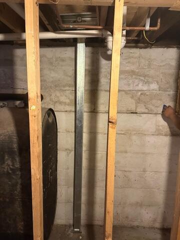 PowerBrace™ Beams: Heavy-duty, zinc-plated steel I-beams were custom-cut to fit the full height of the basement walls. Each beam was anchored securely to the concrete floor and attached to the floor joists at the top using a unique tightening bracket. This setup allows the system to be adjusted over time, gradually helping to straighten the wall back toward its original position.

Tightening Assembly: The adjustable top bracket was installed along each beam, enabling controlled torque adjustments during follow-up visits. This feature provides both immediate stabilization and the potential for long-term wall improvement.

Corrosion Protection: All PowerBrace components were zinc-coated for superior rust resistance, ensuring a clean, finished look and decades of durability even in high-humidity environments.