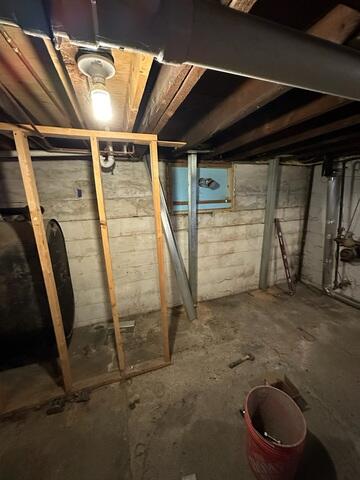 PowerBrace™ Beams: Heavy-duty, zinc-plated steel I-beams were custom-cut to fit the full height of the basement walls. Each beam was anchored securely to the concrete floor and attached to the floor joists at the top using a unique tightening bracket. This setup allows the system to be adjusted over time, gradually helping to straighten the wall back toward its original position.

Tightening Assembly: The adjustable top bracket was installed along each beam, enabling controlled torque adjustments during follow-up visits. This feature provides both immediate stabilization and the potential for long-term wall improvement.

Corrosion Protection: All PowerBrace components were zinc-coated for superior rust resistance, ensuring a clean, finished look and decades of durability even in high-humidity environments.