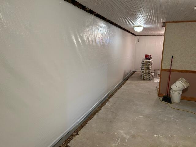 During: Our Foreman, Jose, and his crew worked hard to secure the waterproofing products throughout the basement.