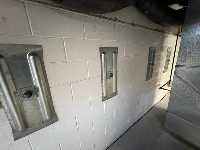 We first installed our GeoLock Wall Anchors to permanently stabilize the homeowner's bowing foundation walls. These heavy-duty steel anchors secure the walls by anchoring them to stable soil outside the home, preventing further movement and helping restore structural integrity.