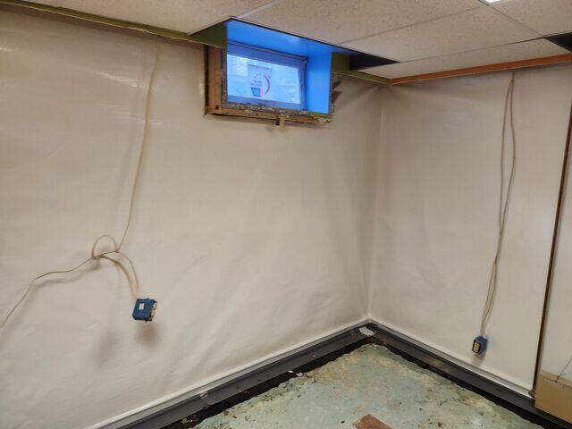 During: Our Foreman, Arturo, and his crew worked hard to install the waterproofing products throughout the basement.
