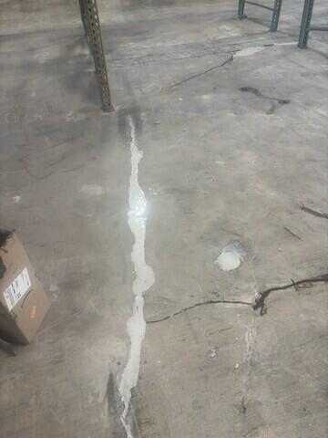 Epoxy grout at large cracks and spalled area.