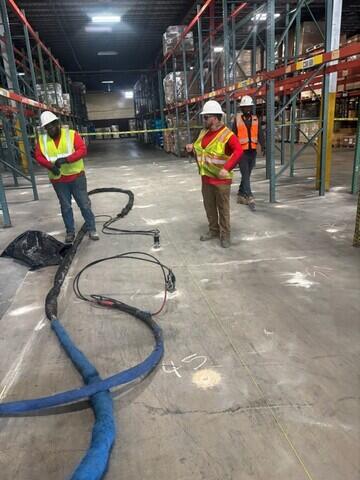 PolyLevel foam equipment setup in warehouse area.