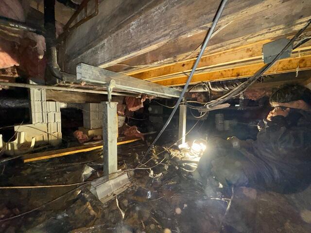 This photo shows the two new SmartJacks attached to a steel beam. The steel beam helps stabilize and lift the new sister joists we installed to the right of the photo.