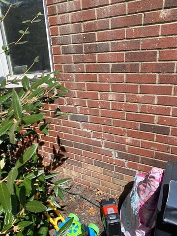 This stair-step crack, found away from the chimney, was a sign that the home was settling in multiple areas.