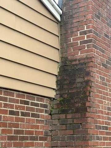 This photo shows the chimney lifted back up against the home. If you want to see how we did it, then be sure to scroll through the photos!
