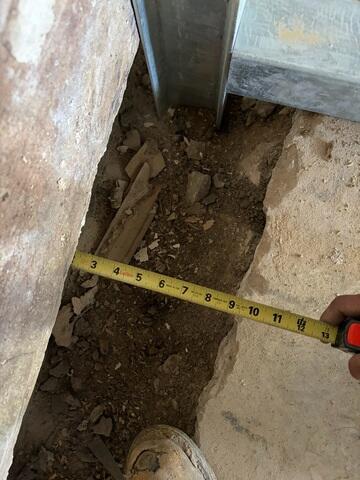 Our Foreman snapped this photo after they had straightened the wall back out. In this case, our team not only had to straighten the wall but also push it back toward its footing-a far more complex process than standard wall correction. Typically, we're working to realign a bowed wall, but when a wall has also sheared, it must be pushed horizontally as well as vertically adjusted. Every movement has to be slow, measured, and precise to keep the structure stable. That combination made this repair especially challenging and a true testament to the crew's skill and control, even though it was just a few inches.