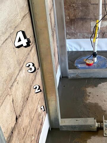 You can see that we effectively closed the space between the leaning block wall and the vertical brace from this after photo.