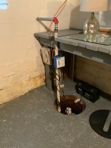 The homeowner's old sump pump was no longer able to keep up with the volume of water entering the basement, causing water to accumulate and creating a persistent moisture problem.