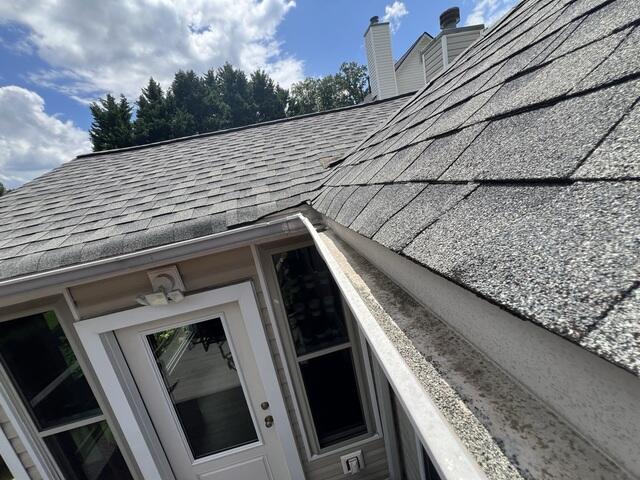 Open K-style gutters collect debris, forcing homeowners to climb ladders for maintenance.