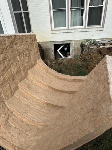 This photo shows a close up of the tan RockWell. This well mimics the pattern of natural stone, and has built in stairs for safe and easy access. This well also comes in a gray color as well.