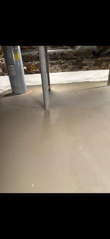 WaterGuard® Interior Drainage System: Installed along the basement perimeter to collect water seeping from the walls, wall‑floor joint, and under the slab. It safely directs water to the sump system.ThermalDry® Drainage Matting: Laid across the floor to allow any under‑slab water to flow freely toward the WaterGuard® drainage system while providing an insulating barrier beneath the new concrete slab.