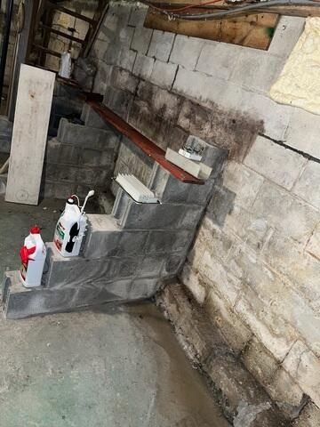 Water seeped through the basement walls of this Plymouth, New Hampshire, home.