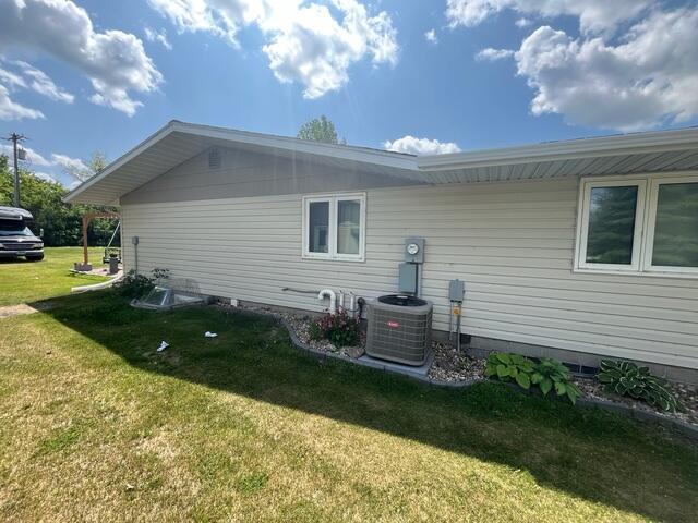 Before: Ian, one of our Design Specialists, recommended installing a Radon Mitigation System outside the home.
