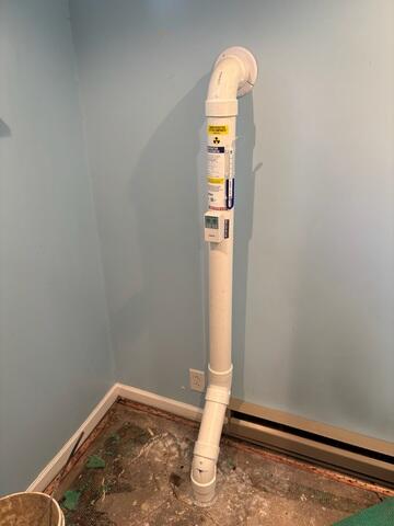 The PVC pipe is installed in the footing of the home and connected to the fan