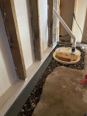 During: Our Foreman, Franklin, and his crew secured the WaterGuard and TripleSafe in the corner of the basement.