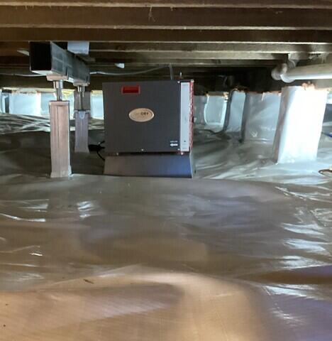 The crawl space is now fully encapsulated with our CleanSpace vapor barrier and the SaniDry Sedona dehumidifier keeps humidity low.