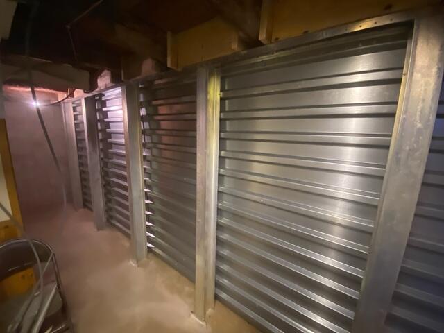 This image captures the finished EverBrace™ installation, with full-height steel panels and support beams covering the previously failing wall. The system now provides a clean, rigid, and permanent solution to severe wall deterioration.