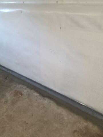 WaterGuard was installed around the perimeter of the basement to direct any seeping water from the walls to the sump pumps for removal.