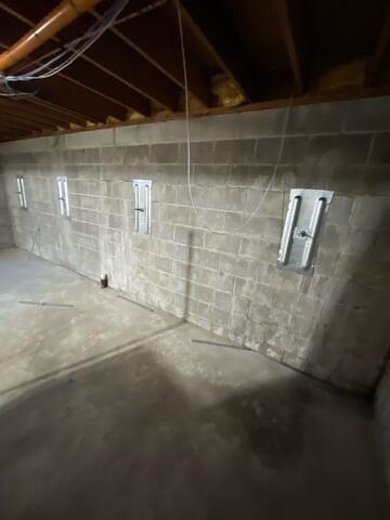 During: Our Design Specialist, Dylan, recommended installing GeoLock Wall Anchors along the basement walls.