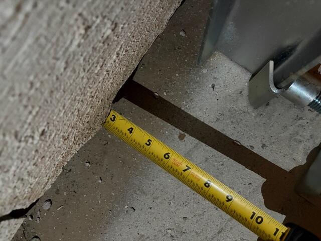 This ruler actually doesn't start at the three mark. The other three inches are hidden underneath the sheared part of the wall. This photo was taken before the straightening process, and the angle was snapped from the camera looking straight down at the floor near the wall.