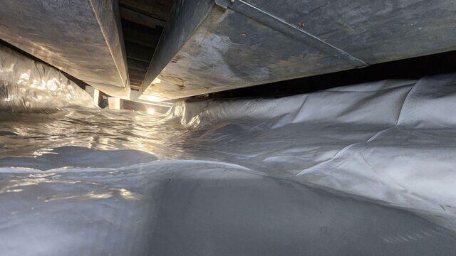 This was what the crawl space looked like after we encapsulated with our vapor barrier. The vapor barrier was sealed at all the seams with tape to ensure no unwanted air could enter.