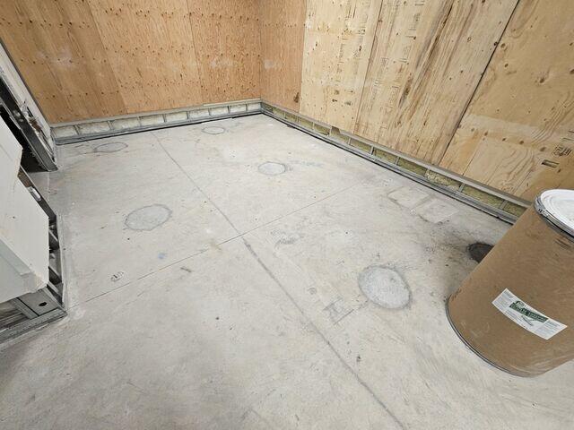 Concrete floor slab ready for or immediately following injection, highlighting the drilled access ports for the specialized polymer leveling system.