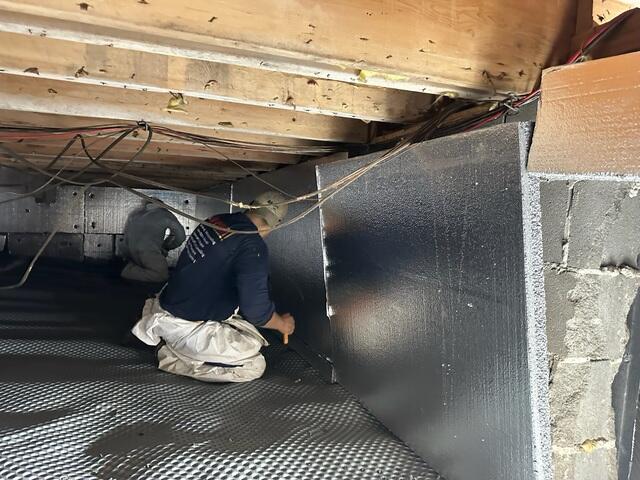 We installed Drainage Matting beneath the vapor barrier to manage any water that may seep up from the ground. This matting creates a vital channel, ensuring water flows freely to the sump pump or drainage system, preventing it from pooling and allowing the space above to stay dry.
