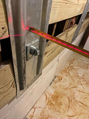 The wall anchor plate connecting to the earth anchor to stabilize the wall