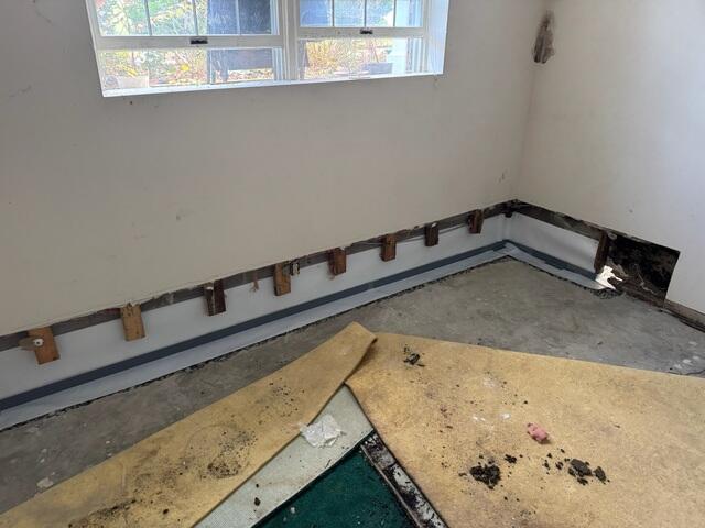 Step 4: We then covered the tops of the drains with a waterproof tape. This tape will prevent moisture transference from the drainage system to the concrete we poured over top, (as seen in the next photo).