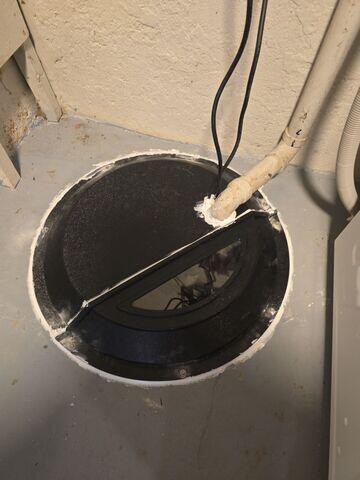 Sump Pit: Dome sump cover sealing the pit to prevent radon entry.