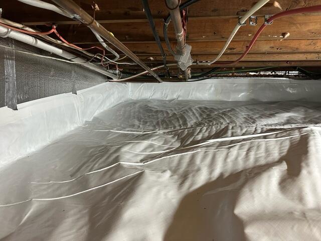 CleanSpace was used to encapsulate the crawl space, sealing out moisture and humidity. SilverGlo was installed on the walls to insulate the space.