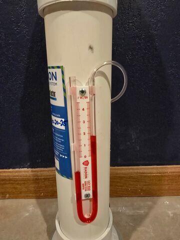 Manometer - System manometer showing active pressure levels, confirming the mitigation system is operating properly.