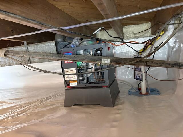SaniDry Sedona was placed in the crawl space to rid the air of humidity. SmartSump was installed in the corner to pump out moisture.