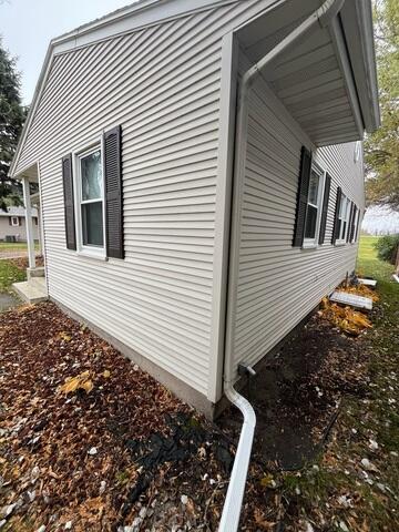 Before: Our Design Specialist, Ian, recommended installing a Radon Mitigation System outside of the home.