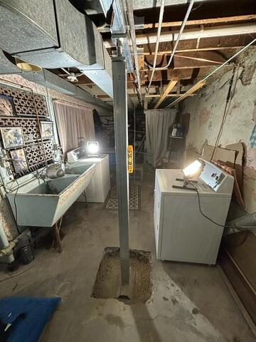 During: The crew successfully secured a new support beam and SmartJacks in the basement.