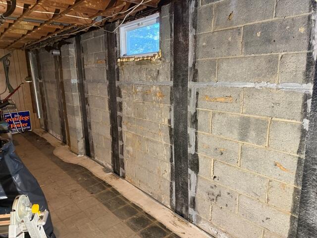 CarbonArmor straps installed along the bowing foundation wall, providing strong, permanent stabilization without intrusive excavation.