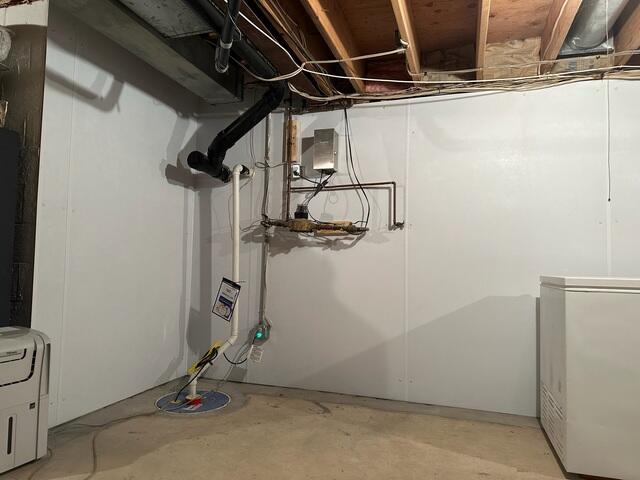 Completed system with WaterGuard perimeter, SuperSump, and Foamax wall liners fully installed, creating a dry and reinforced basement.