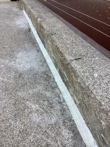 Photo 2 shows the expert application of our premium crack and joint sealant. The newly laid material immediately forms a robust, flexible barrier, making the joint watertight and ready to protect the concrete from future movement and erosion.